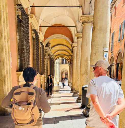 A casual walk reveals the timeless charm of Bologna's arches.