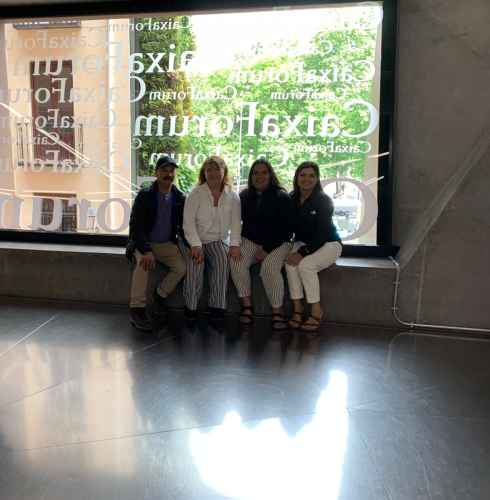 Enjoying a quiet moment by the gallery window in Madrid.