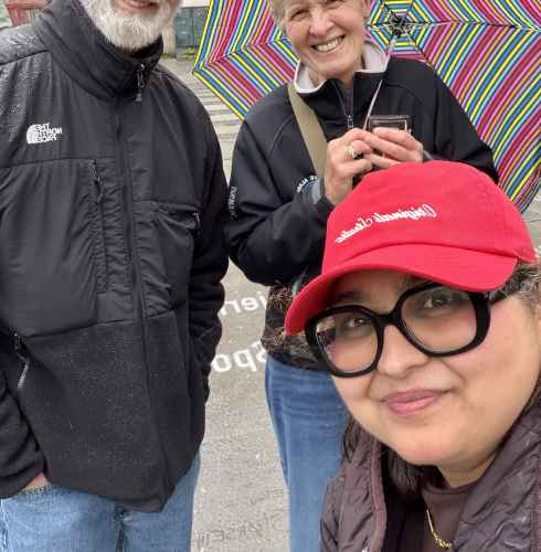 Enjoying a rainy Oslo day with smiles and stripes.