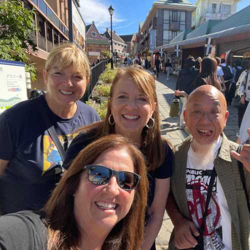 Sunlit Smiles on a Bustling Street