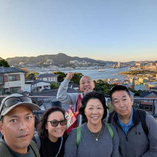 Embracing the View: A Family Moment Above the Bay