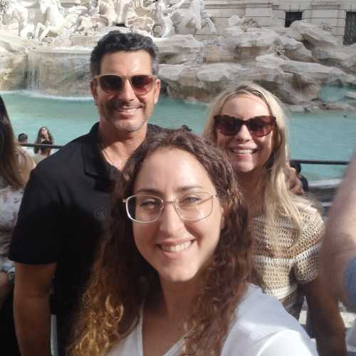 Sunlit Smiles by the Fountain of Wishes