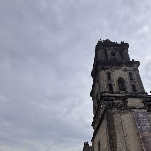 Embracing History: Friends at the Tower's Foot