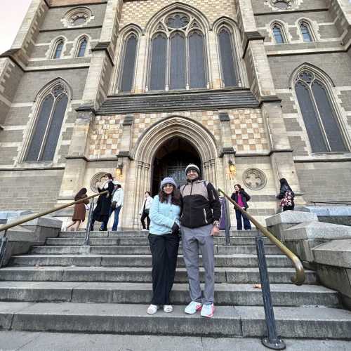 Wanderers' Pause: Captured Before the Cathedral's Grandeur