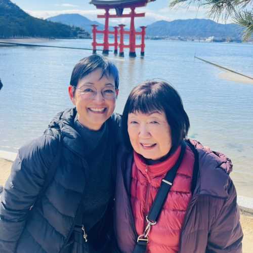 Smiles by the Historic Torii Gate