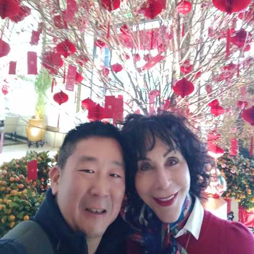 Blossoms and Smiles Amidst a Red Celebration