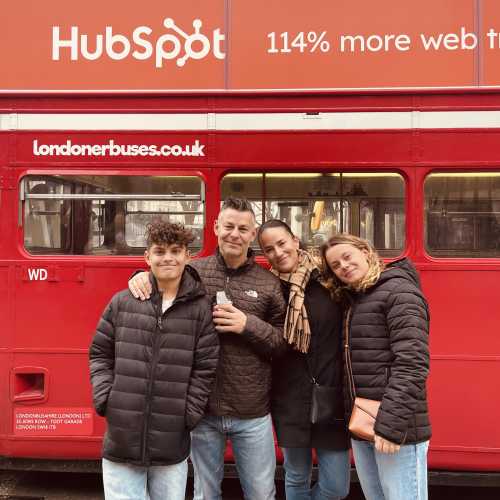 In Front of London's Iconic Red Bus: A Family Adventure