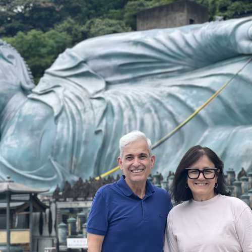 Serene Encounter: Guests at the Majestic Reclining Buddha