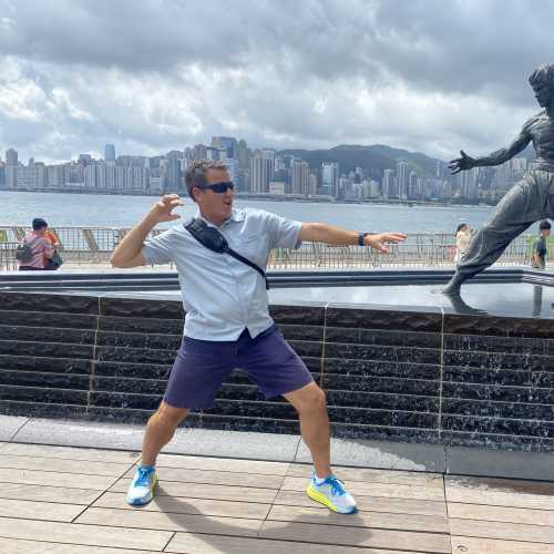 Showdown by the Harbor: A Playful Dance with a Legend