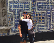 A colorful embrace against iconic tiles