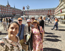 Sunlit Smiles in Madrid's Majestic Plaza
