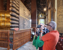 Capturing Serenity: Visitors at the Reclining Buddha
