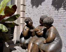 Whispers in Bronze: A Sunlit Conversation