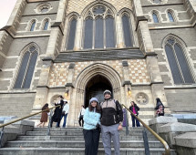 Wanderers' Pause: Captured Before the Cathedral's Grandeur