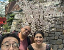 Blossoms and Smiles Under Glass Skies