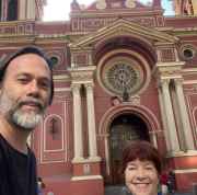 Two people in front of Basilica de la Merced in Santiago.