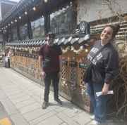 Visitors exploring Seoul's charming streets lined with decorations.