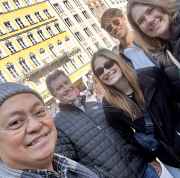 A joyous group captured against the colorful facades of Munich.