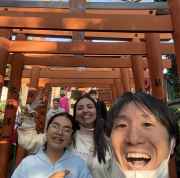 A candid moment captured under the iconic gates of Japan.