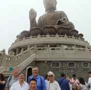 A group gathers beneath the serene gaze of Hong Kong's Buddha.