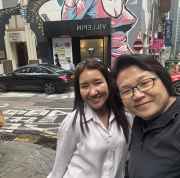 Capturing a cheerful scene against Hong Kong's artistic backdrop.