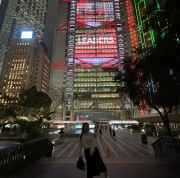 Night lights of Hong Kong create a striking urban backdrop.