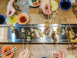 Travelers enjoying a multi course meal on a Kyoto food