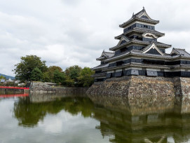 Matsumoto-jō Castle with cobble stone bricks and a red