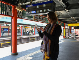 Traveler waiting at a train station in Japan