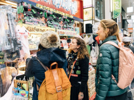 People outside a stall in Tokyo