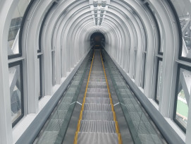 Shadowed escalators between Umeda towers with glass walls and city visible beyond. Photo by ODEGORO on Shutterstock. Shadowed escalators between Umeda towers with glass walls and city visible beyond. Photo by ODEGORO on Shutterstock.