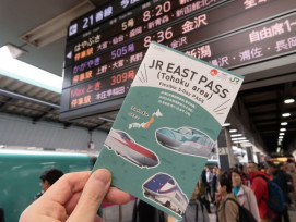 Tourist showing their Japan Rail Pass Tourist showing their Japan Rail Pass