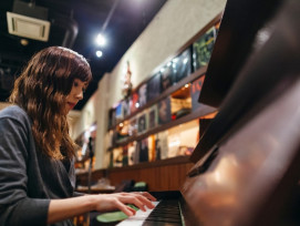 Local host checking a guest's preferences at a bar. Local host checking a guest's preferences at a bar.