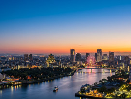Osaka skyline transitioning from day to night Osaka skyline transitioning from day to night
