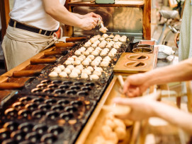 Fresh takoyaki on the grill. Fresh takoyaki on the grill.
