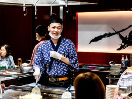 Smiling host explaining dish history to engaged guest while holding traditional cooking utensil. Photo by hiurich granja on Unsplash Smiling host explaining dish history to engaged guest while holding traditional cooking utensil. Photo by hiurich granja on Unsplash