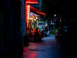A narrow alley in Ura Namba with small bars and restaurants, their warm light spilling onto the street where a few locals chat outside. Photo by Rapha Wilde on Unsplash A narrow alley in Ura Namba with small bars and restaurants, their warm light spilling onto the street where a few locals chat outside. Photo by Rapha Wilde on Unsplash