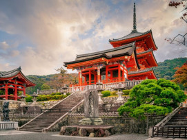Kiyomizu-dera Temple's wooden platform at dawn with city views before heat haze forms. Kiyomizu-dera Temple's wooden platform at dawn with city views before heat haze forms.