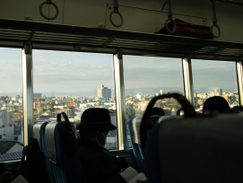 Host and traveler riding a local Kyoto bus with city views outside the window Photo by yongzheng xu on Unsplash Host and traveler riding a local Kyoto bus with city views outside the window Photo by yongzheng xu on Unsplash