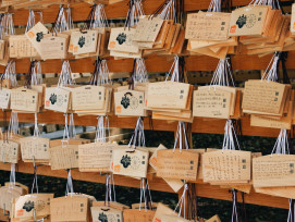 Wooden prayer plaques (ema) with hair-related wishes written on them.Photo by Wan Chen on Unsplash Wooden prayer plaques (ema) with hair-related wishes written on them.Photo by Wan Chen on Unsplash