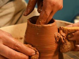 Artisan working on traditional pottery with focused concentration Photo by Taya Kucherova on Unsplash