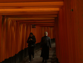 Traveler walking through Fushimi Inari's orange gates with a local host. Photo by Charlie Charoenwattana on Unsplash Traveler walking through Fushimi Inari's orange gates with a local host. Photo by Charlie Charoenwattana on Unsplash