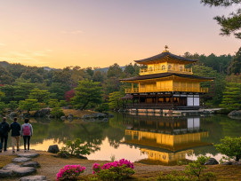 Guests walking toward the Golden Pavilion in soft morning light Guests walking toward the Golden Pavilion in soft morning light