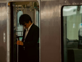 A traveler boarding a train from Osaka to Kyoto in the morning, with a local guide holding a sign and ready to begin the tour Photo by XS Xue on Unsplash A traveler boarding a train from Osaka to Kyoto in the morning, with a local guide holding a sign and ready to begin the tour Photo by XS Xue on Unsplash