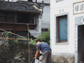 Elderly man sweeping fallen leaves outside a traditional shop. Photo by Raychan on Unsplash Elderly man sweeping fallen leaves outside a traditional shop. Photo by Raychan on Unsplash
