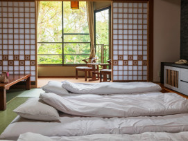 Traditional ryokan room with futon and low table photo by Blanscape on Shutterstock Traditional ryokan room with futon and low table photo by Blanscape on Shutterstock