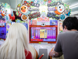 Travelers playing a arcade game