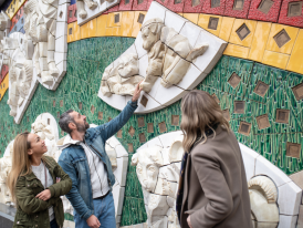 Couple admiring art with a local guide