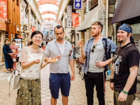 Tourists snacking in Asakusa