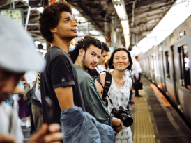 Tourists waiting to board the train, Japan